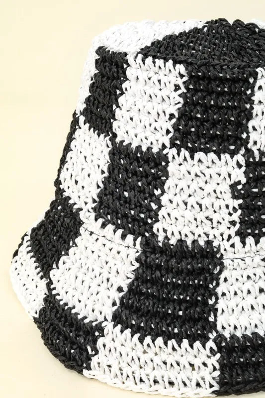 Black and white checkered pattern on a textured surface