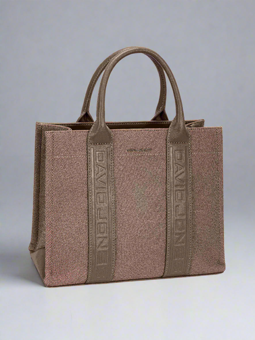 Brown handbag with visible brand logo on a light gray background