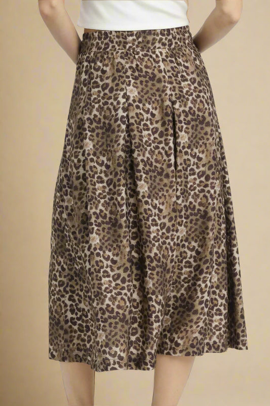 Leopard print skirt worn by a person on a white background