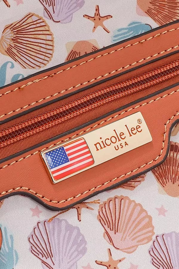 Close-up of a brown leather product with 'nicole lee' branding and an American flag emblem on a shell-patterned background.