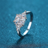 Beach Rose Co. 3 carat moissanite three-stone ring in rhodium-plated sterling silver with square and triangular cuts.