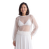 Beach Rose Co. white sheer mesh top with scattered sequins and long balloon sleeves worn over a white bralette.