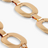 Beach Rose Co. gold-tone ferroalloy chain belt featuring polished open oval links in a close-up view.