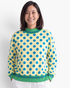 Beach Rose Co. yellow polyester sweatshirt with blue polka dots and green striped trim on a smiling woman.