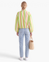 Beach Rose Co. striped zip-up jacket with balloon sleeves and elasticized hem, worn with light wash jeans.