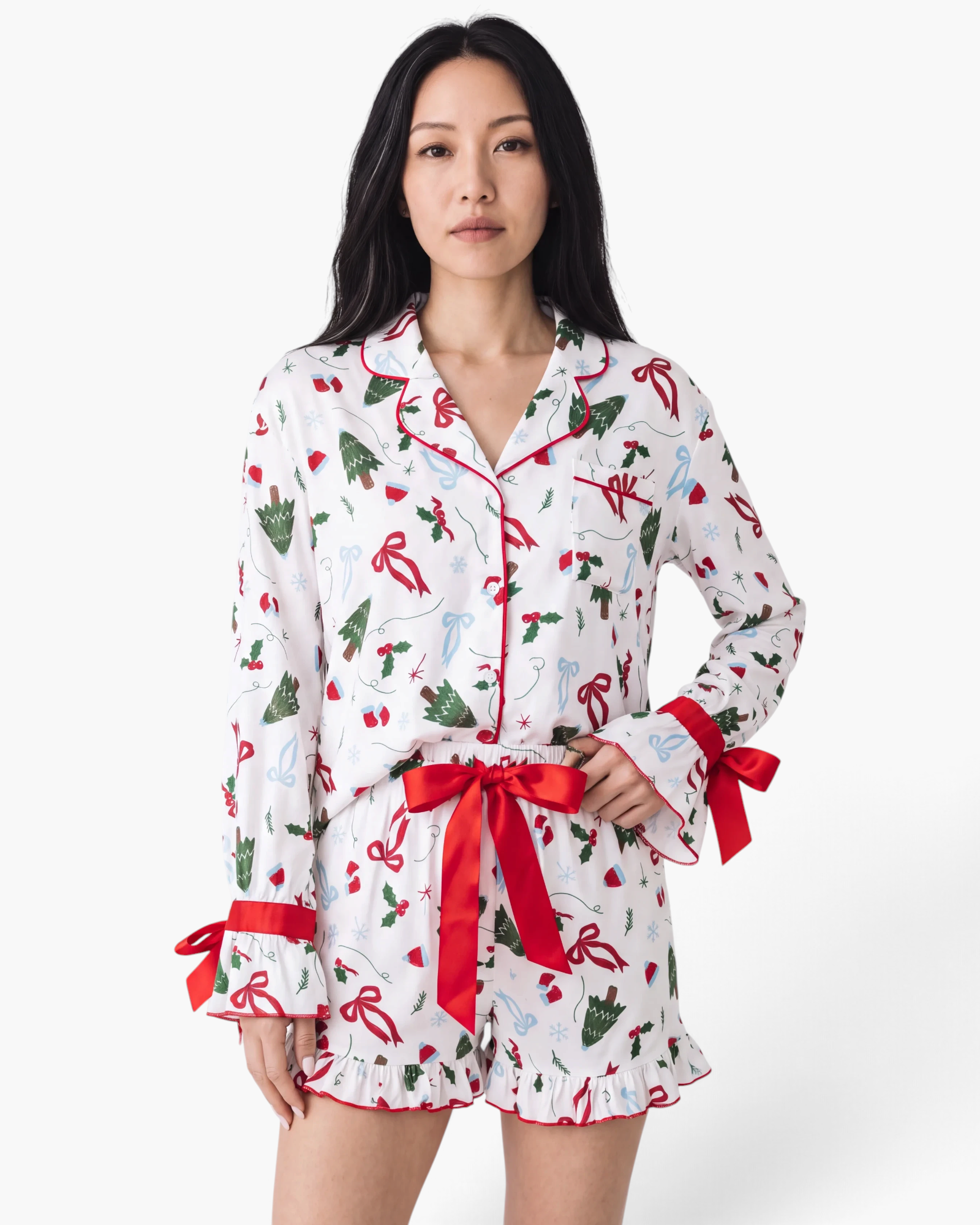 Beach Rose Co. white viscose pajama set with Christmas tree print, red bows, and ruffled shorts hem.