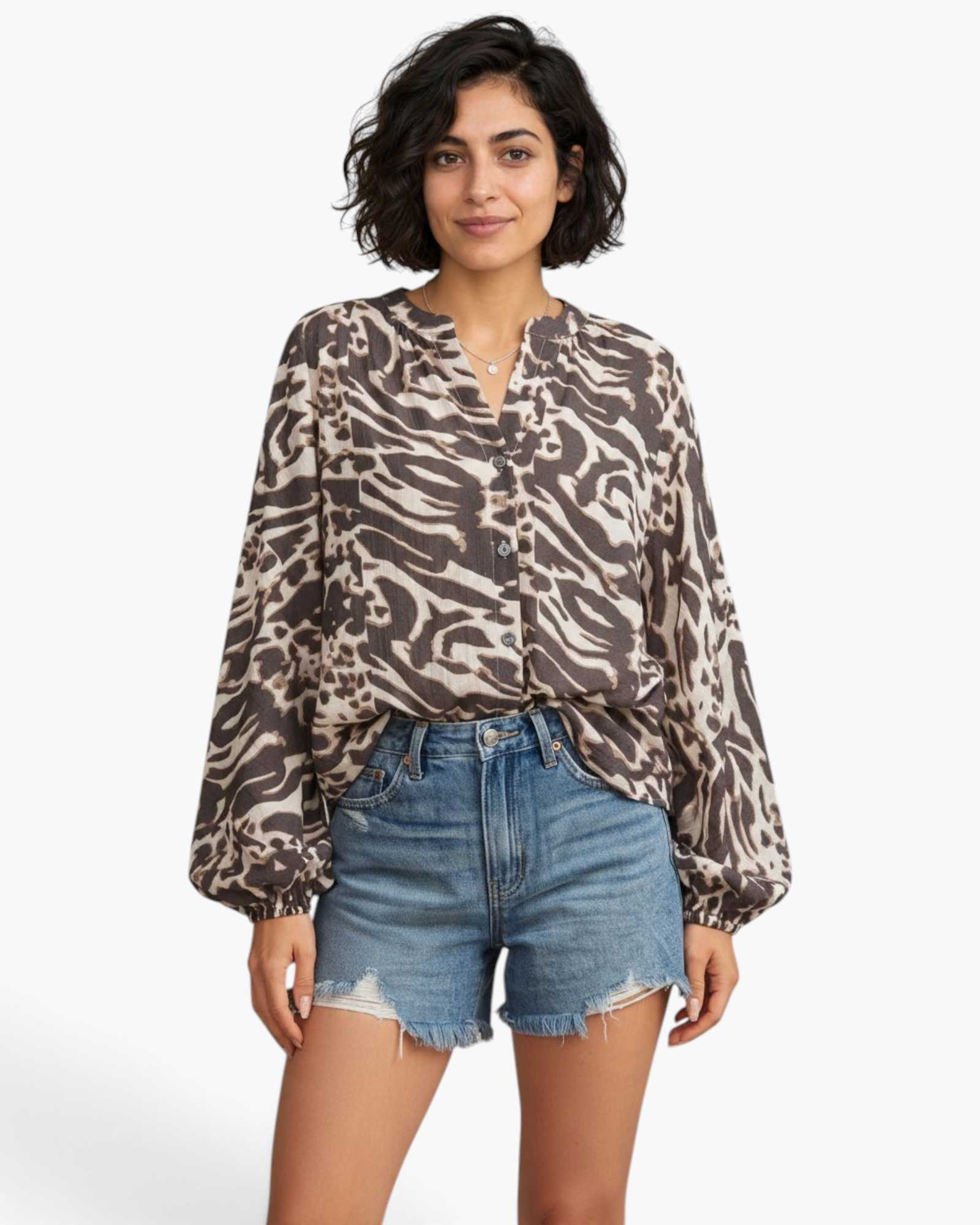Beach Rose Co. charcoal and cream viscose blend blouse with mixed animal print, split neckline and billowy sleeves.