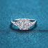 Beach Rose Co. 3 carat moissanite three-stone ring in rhodium-plated sterling silver with square and triangular cuts.