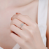 Beach Rose Co. sterling silver solitaire ring featuring a square moissanite stone in a four-prong setting on a hand.