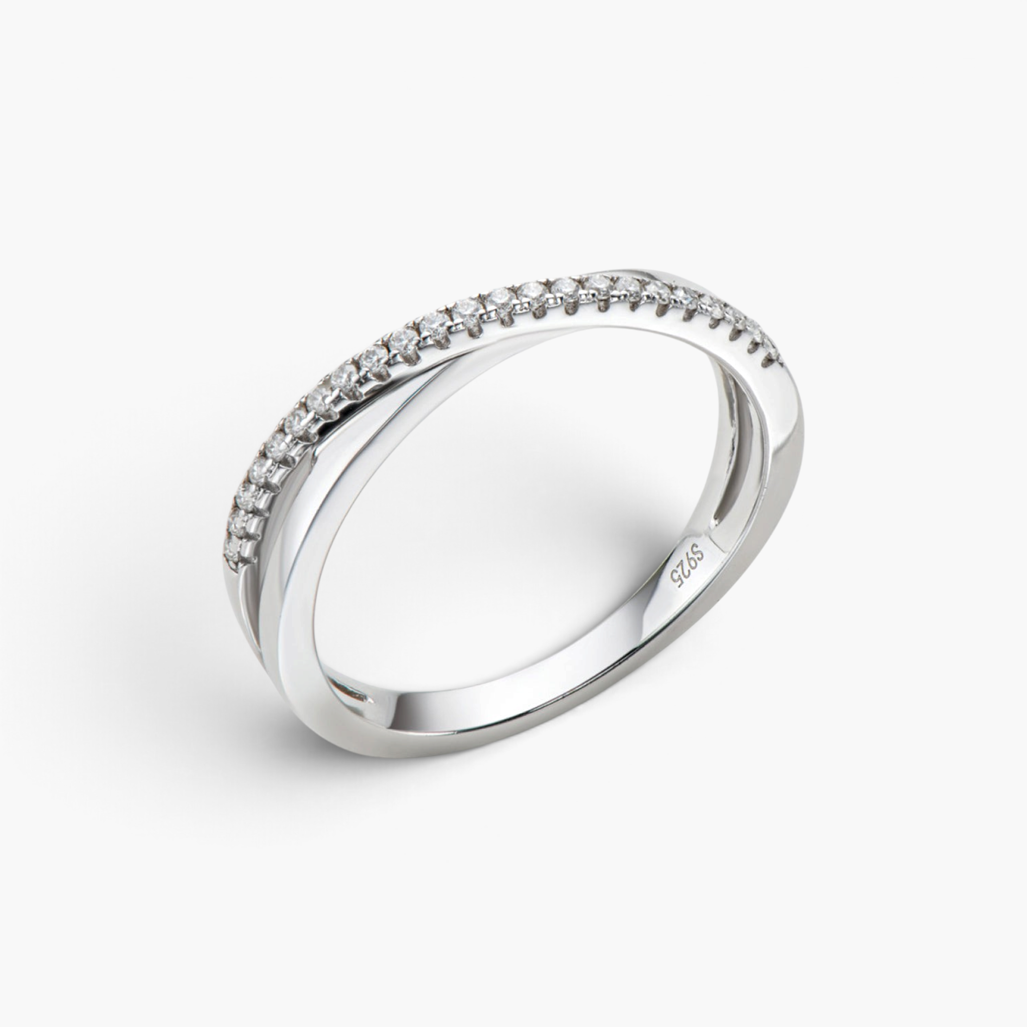 Beach Rose Co. sterling silver crisscross ring featuring a delicate band with sparkling moissanite stones.