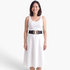 Beach Rose Co. black stretch belt with a gold-tone textured double circle buckle worn over a white dress.