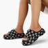 Beach Rose Co. black and white checkered frayed denim platform slides worn on feet with an open toe slip-on design.