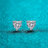 Beach Rose Co. heart-shaped moissanite stud earrings in rhodium-plated sterling silver with three-prong settings.