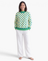 Beach Rose Co. yellow polyester sweatshirt featuring blue polka dots and green striped trim on a model.