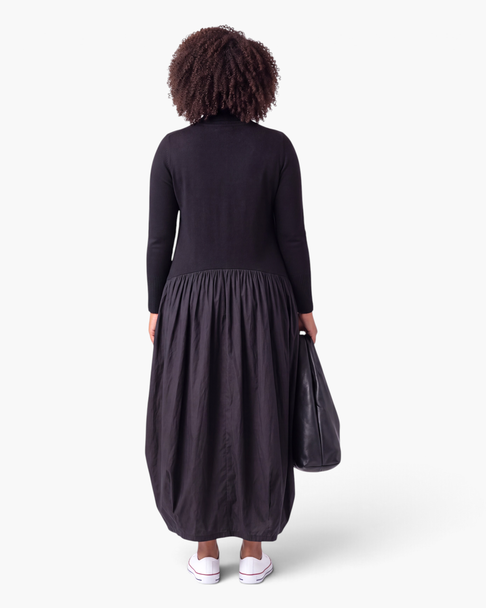 Beach Rose Co. black long-sleeve maxi dress with a sweater bodice, gathered skirt, and sculptural balloon hem.