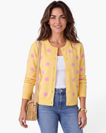 Beach Rose Co. yellow knit cardigan with pink polka dots, round neckline, and button-front closure.