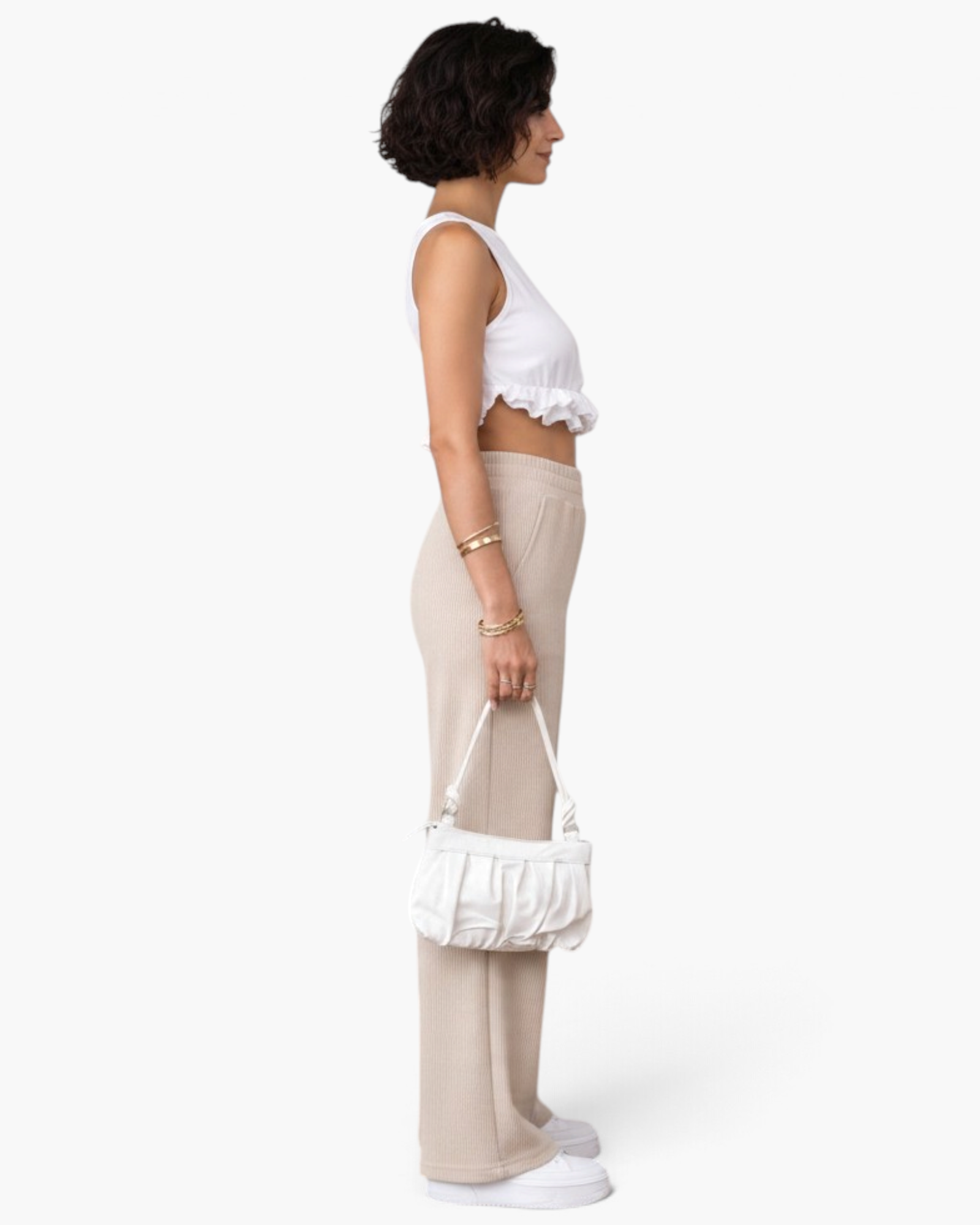 Beach Rose Co. cream ribbed wide-leg pull-on pants with an elastic waistband and side pockets, side profile view.
