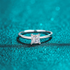 Beach Rose Co. square moissanite solitaire ring in rhodium-plated sterling silver with a four-prong setting.