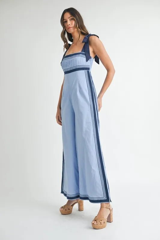 Mable - Sleeveless Chambray Blue Jumpsuit with Navy Trim