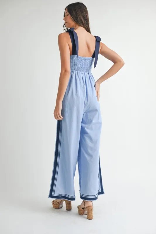 Mable - Sleeveless Chambray Blue Jumpsuit with Navy Trim