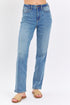 Light blue jeans worn by a person on a white background
