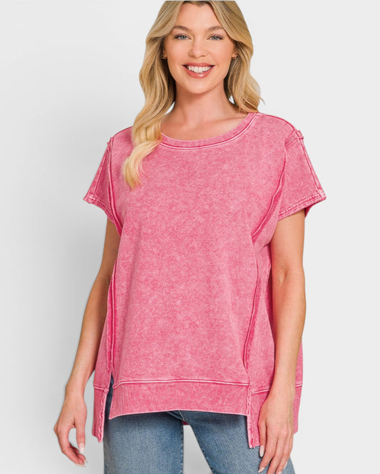 Woman wearing a pink t-shirt against a white background