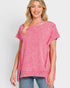 Woman wearing a pink t-shirt against a white background